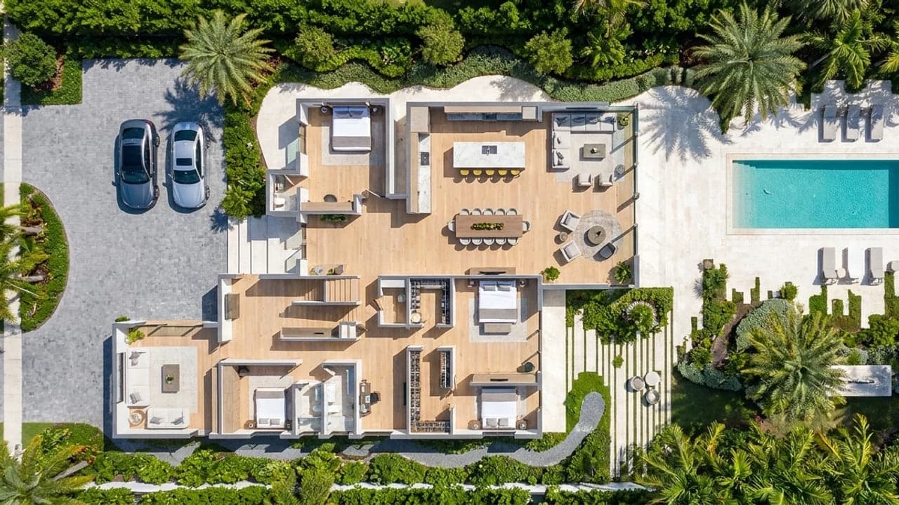 Aerial view of a Luxom Coconut Grove residence master site plan, showing the main house, pool, motor court, and landscaped setbacks around the buildable envelope