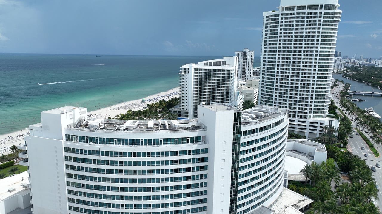Aerial view of the curving Fontainebleau hotel by Morris Lapidus on the oceanfront in Miami Beach