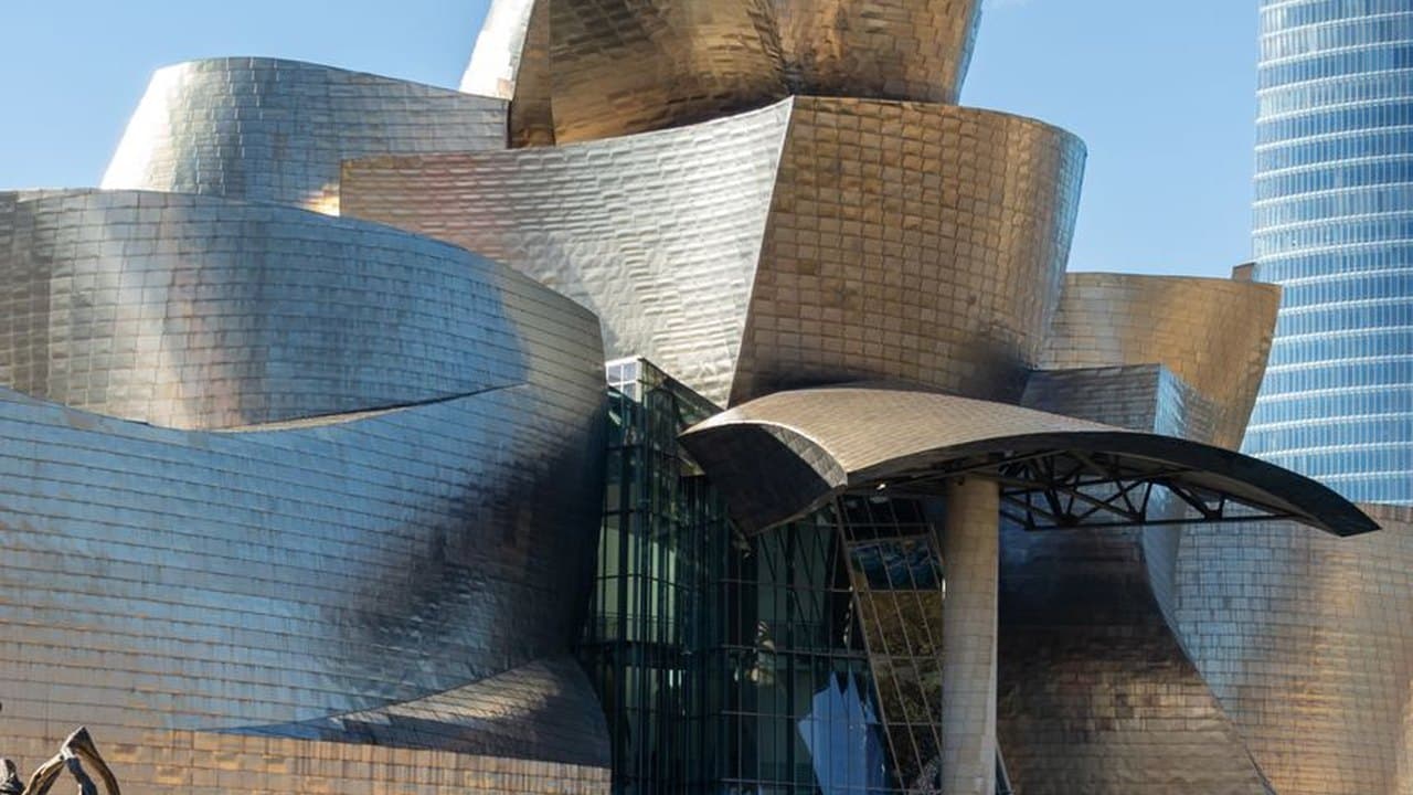 The titanium curves of the Guggenheim Museum Bilbao by Frank Gehry beside the Nervion river