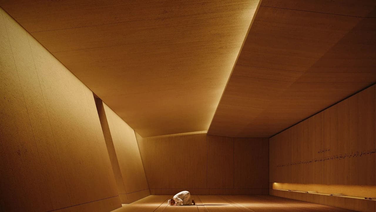 Angled wood-clad ceiling detail in a Luxom residence, showing precise joinery and proportion rather than raw square footage