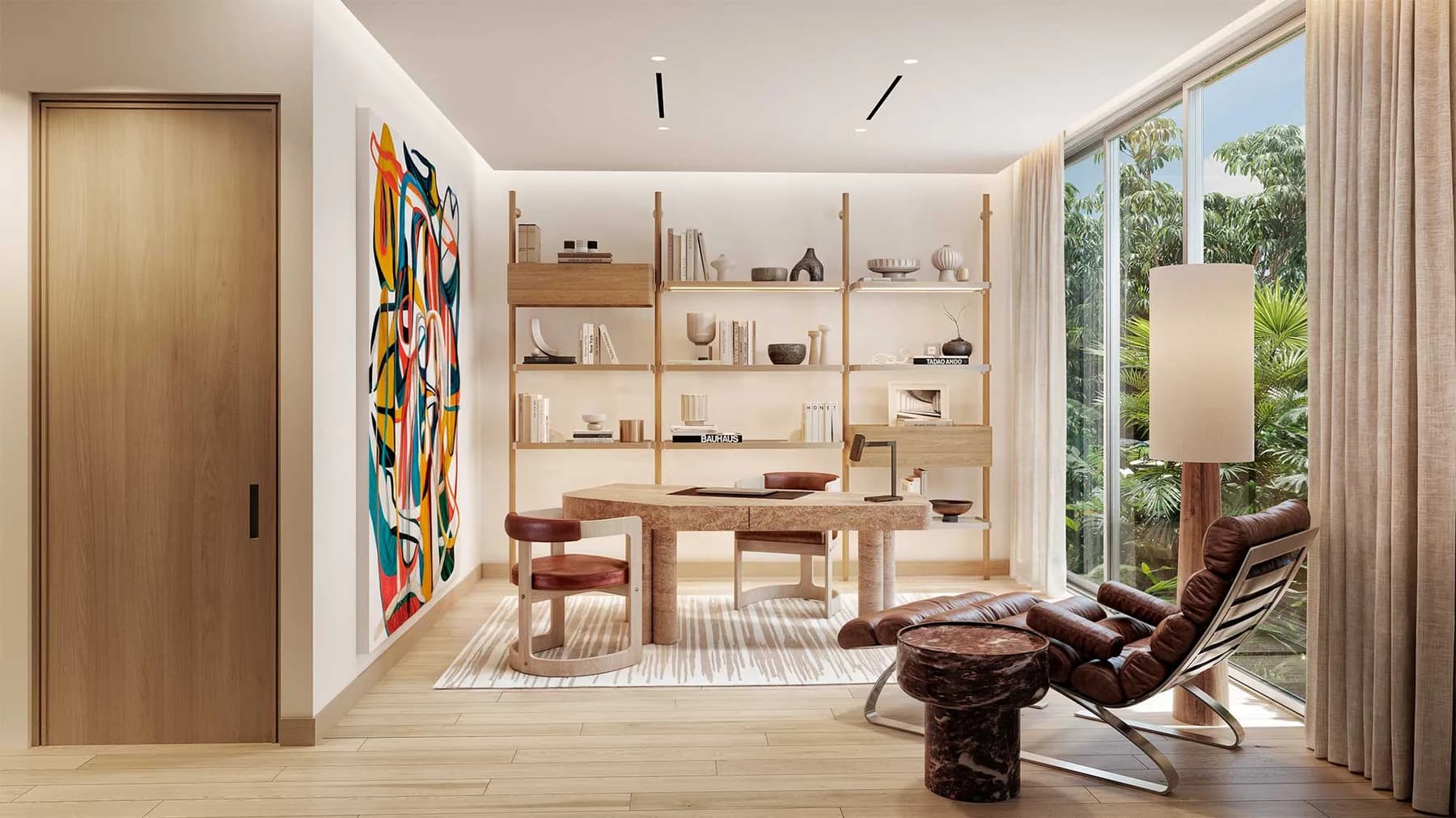 Floor-to-ceiling shelving in the Onaway library, Coconut Grove, with built-in seating beneath the windows