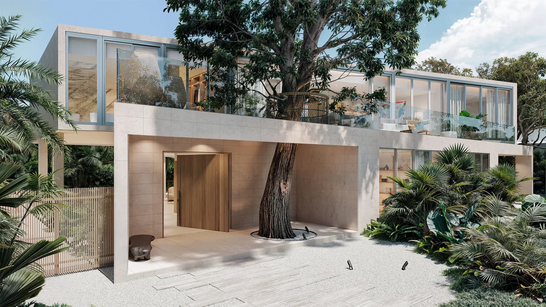 Covered porch at the Onaway Residence in Coconut Grove, Miami, with a seating area beneath a shaded overhang looking out toward the grounds